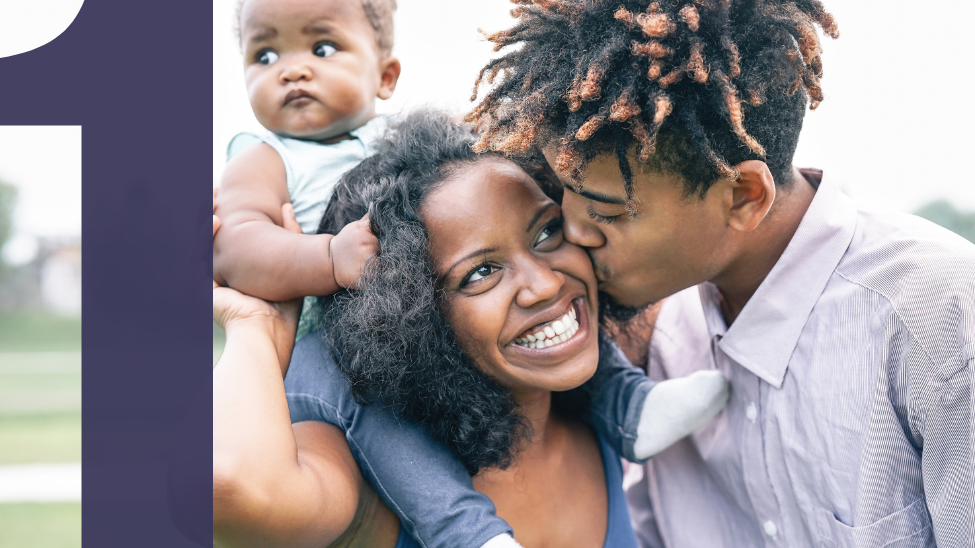 Loving couple with baby on shoulders