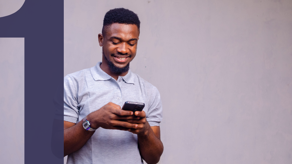 Portrait of a happy African American man on his phone