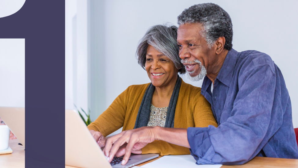 Senior couple logging onto computer