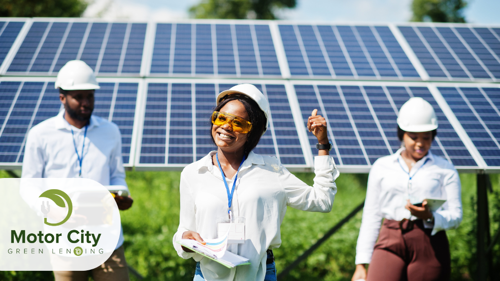 Three technicians in hardhats standing outside in front of solar panels